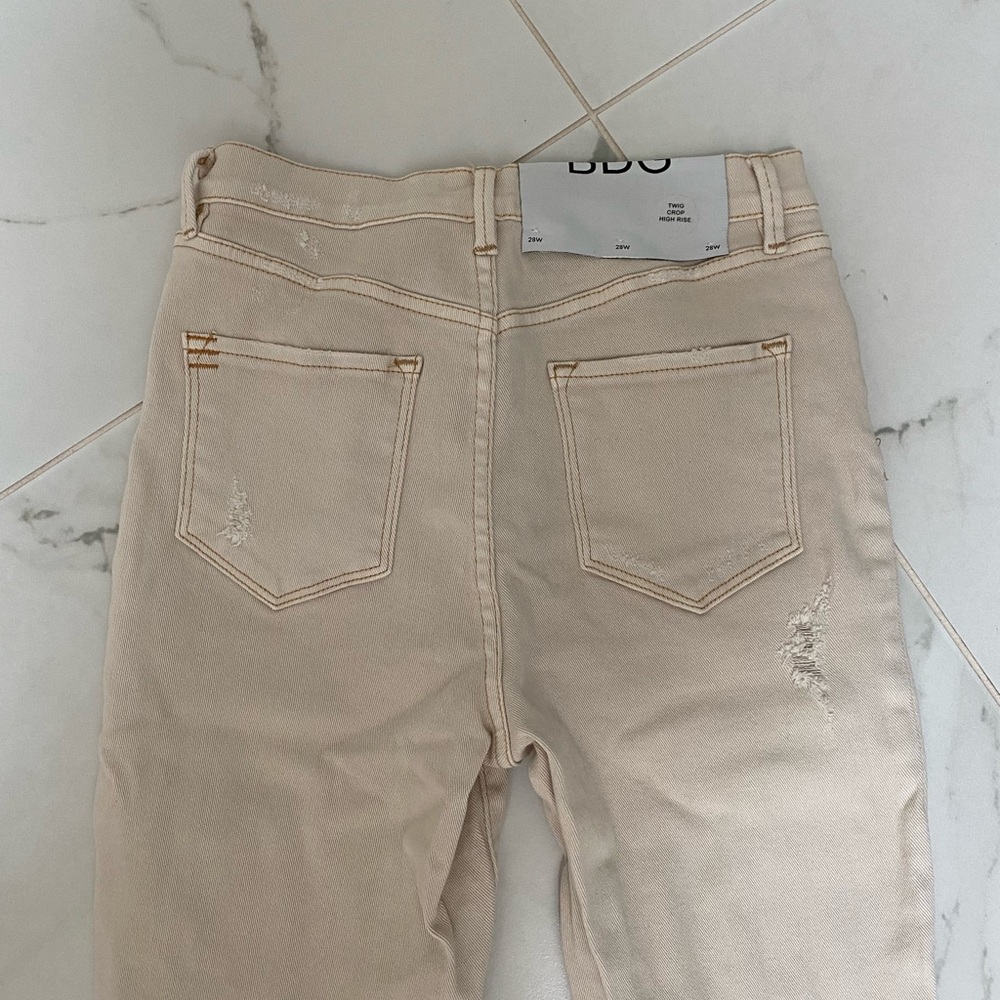 Cream ripped BDG pants